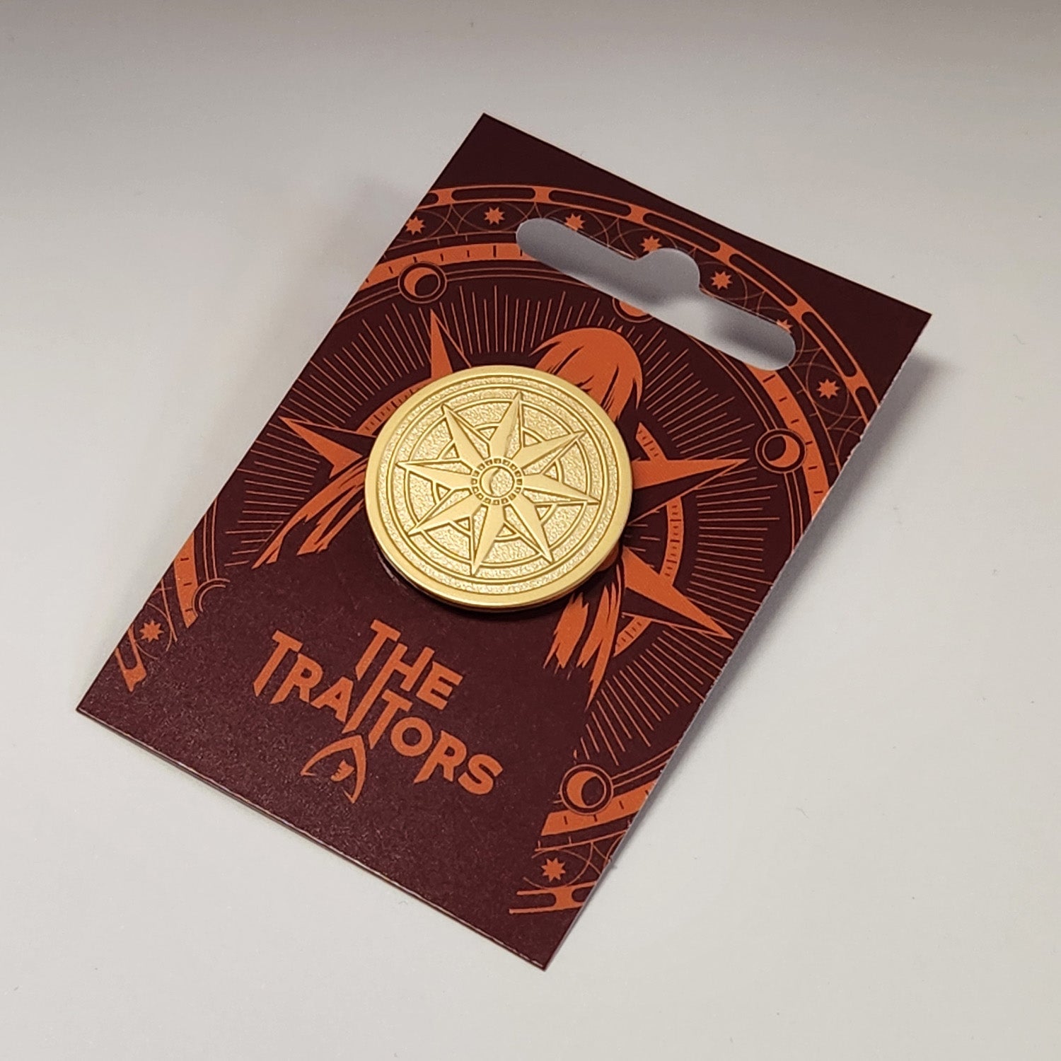 The Traitors Round Table Gold Pin Badge - Live (Click and Collect only) - Traitors Store