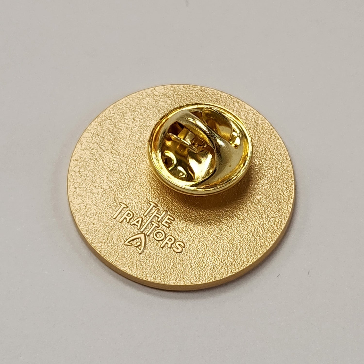 The Traitors Round Table Gold Pin Badge - Live (Click and Collect only) - Traitors Store